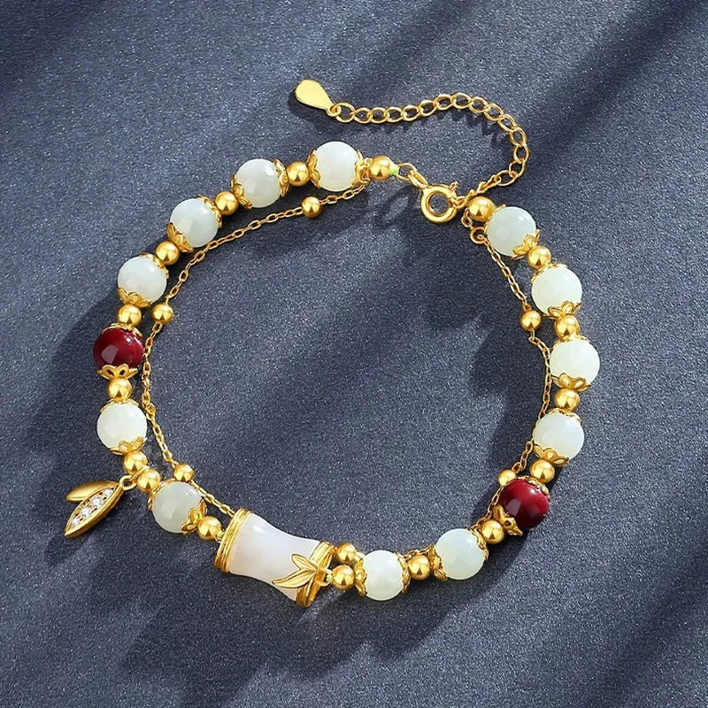 Bamboo-themed bracelet with ruyi motif and coloured flower glass beads on an electroplated chain.