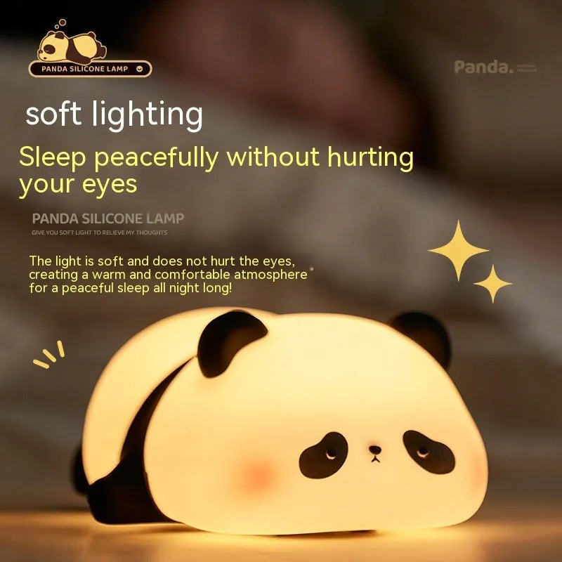 Cute cartoon panda silicone night light for children on a bedside table.