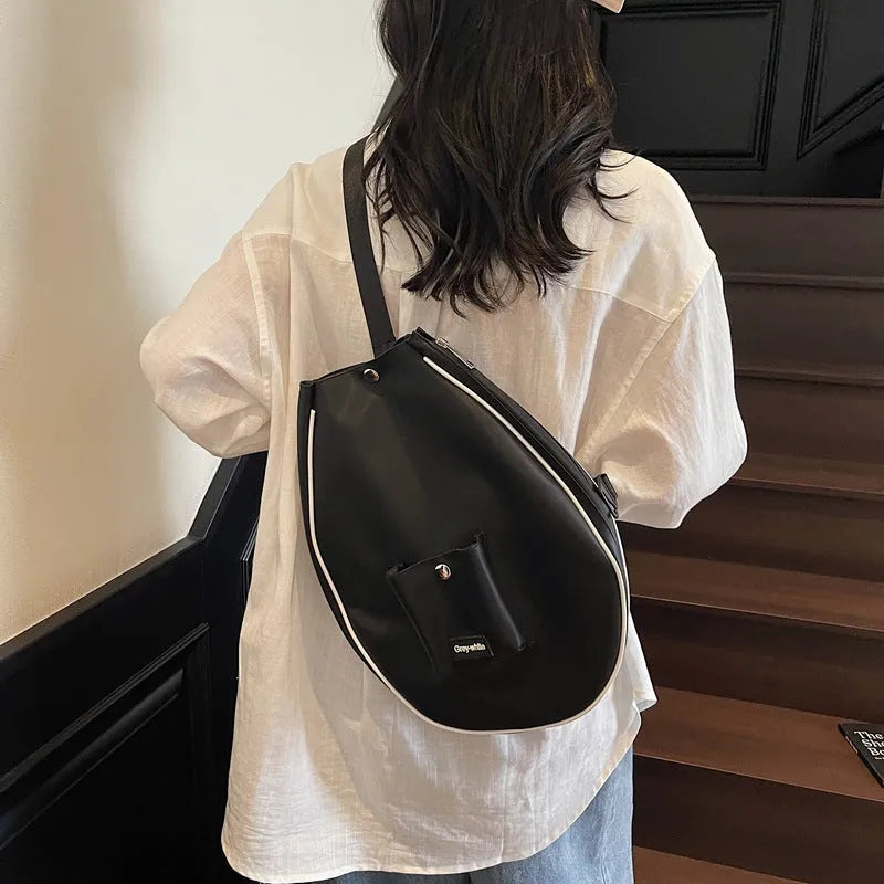 Black one-shoulder yoga storage bag with large 36-55 litre capacity and a single strap.