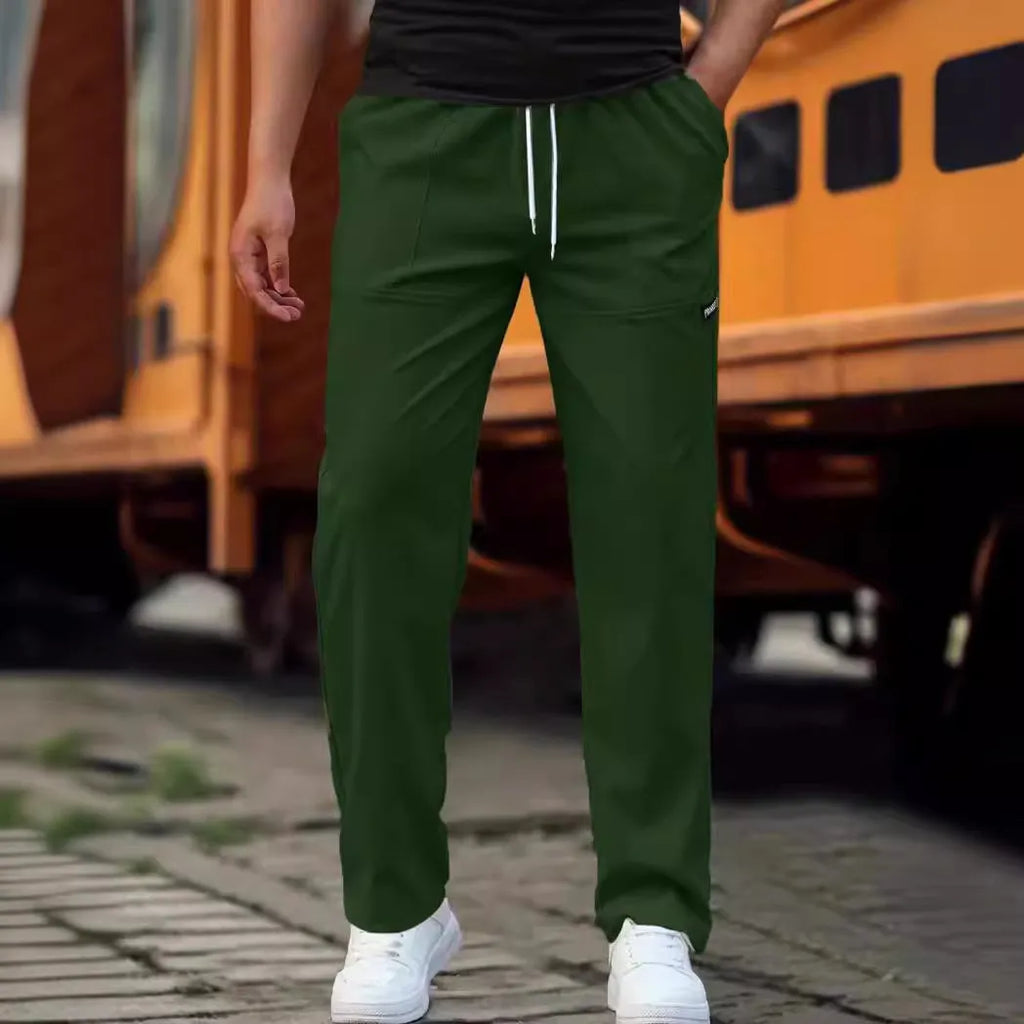 Men's light grey casual chino-style trousers made from polyester for spring and autumn wear.