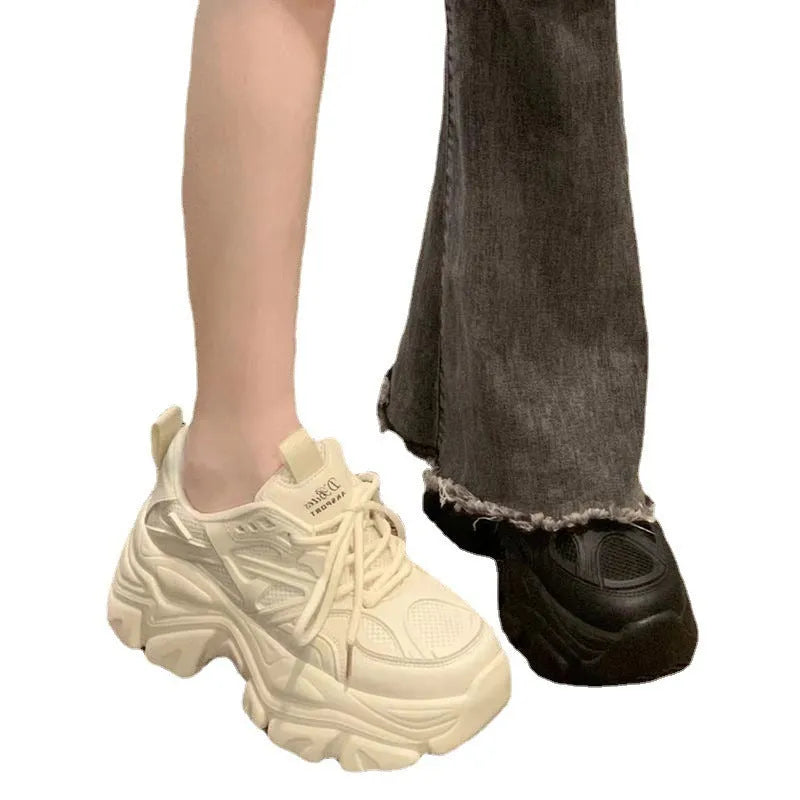 Mid-top platform trainers with 6-8cm high heel, cross strap synthetic leather upper, Goodyear rubber sole, black or creamy white