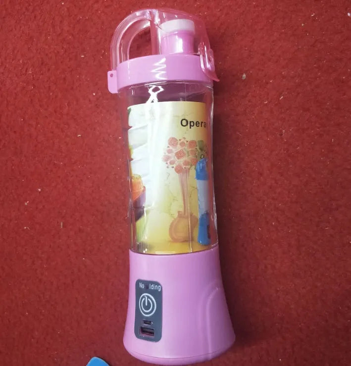 Blue portable electric handheld juicer with USB charging port and 400ml measurement markings on cup.