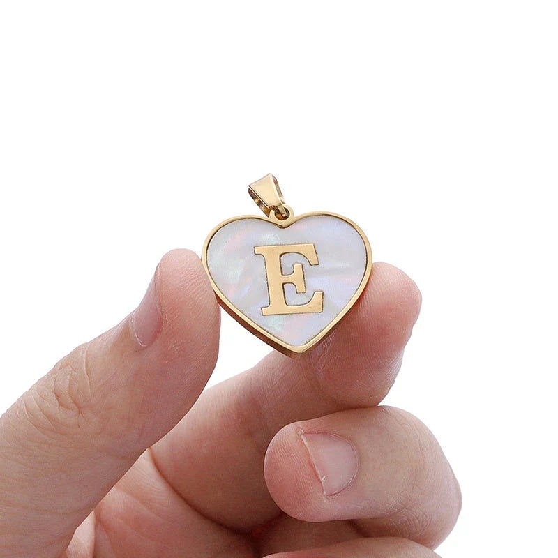 A personalized heart-shaped necklace with a 26-letter charm, crafted from high-quality stainless steel and gold plating.