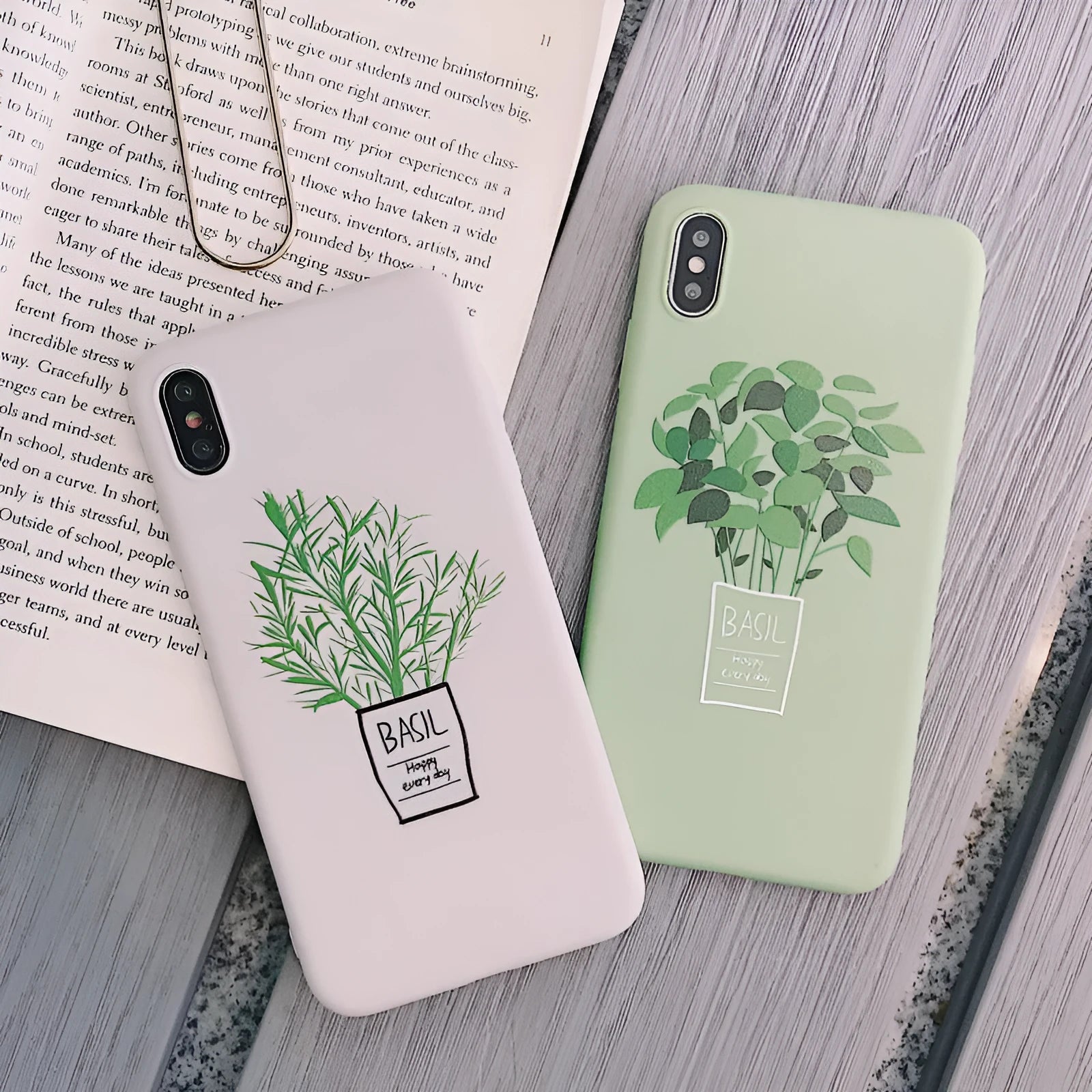 White silicone iPhone case with a detailed painted botanical plant design on the back.