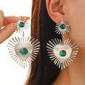 Bohemian sunflower heart-shaped earrings with rhinestones in gold finish on a white background