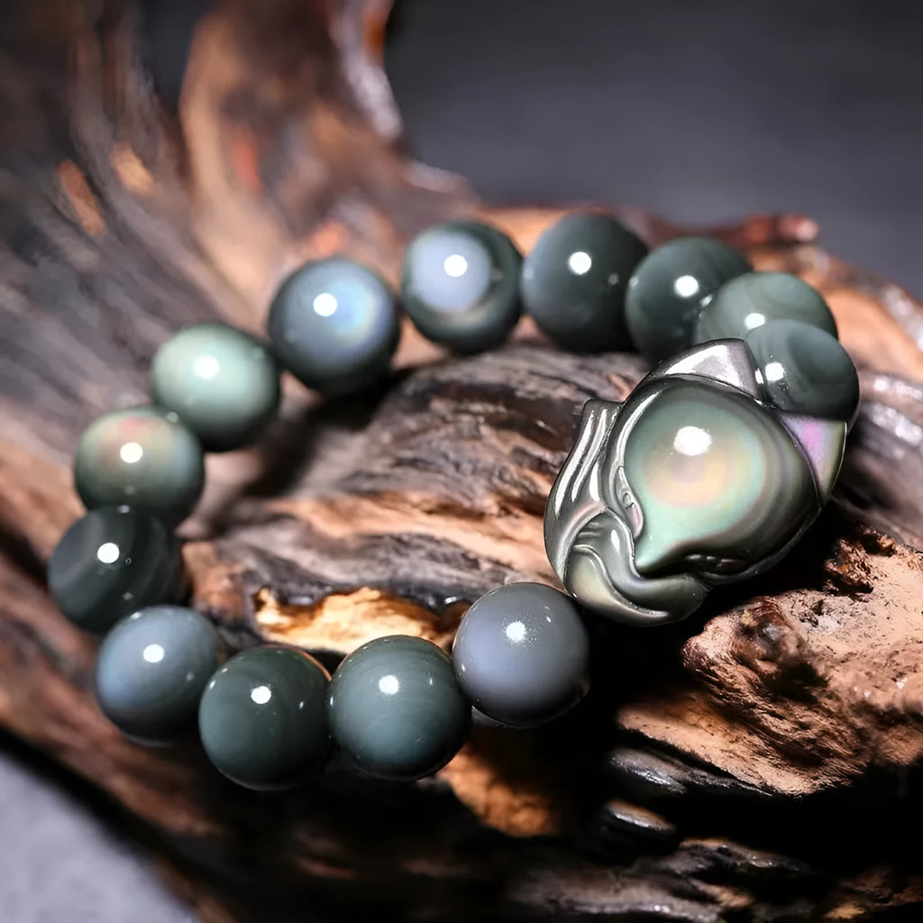 Obsidian bracelet carved with fox or zodiac animal design in cartoon style