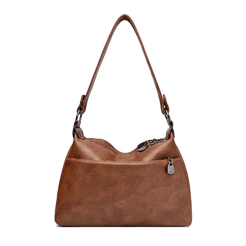 Genuine leather double-sided kangaroo crossbody bag in black with belt decoration and soft sheepskin finish.