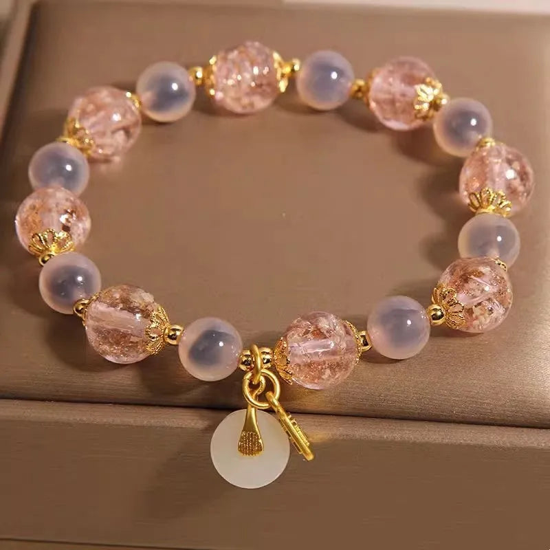 Women's pink heart agate bracelet with peace buckle closure and luminous glaze details