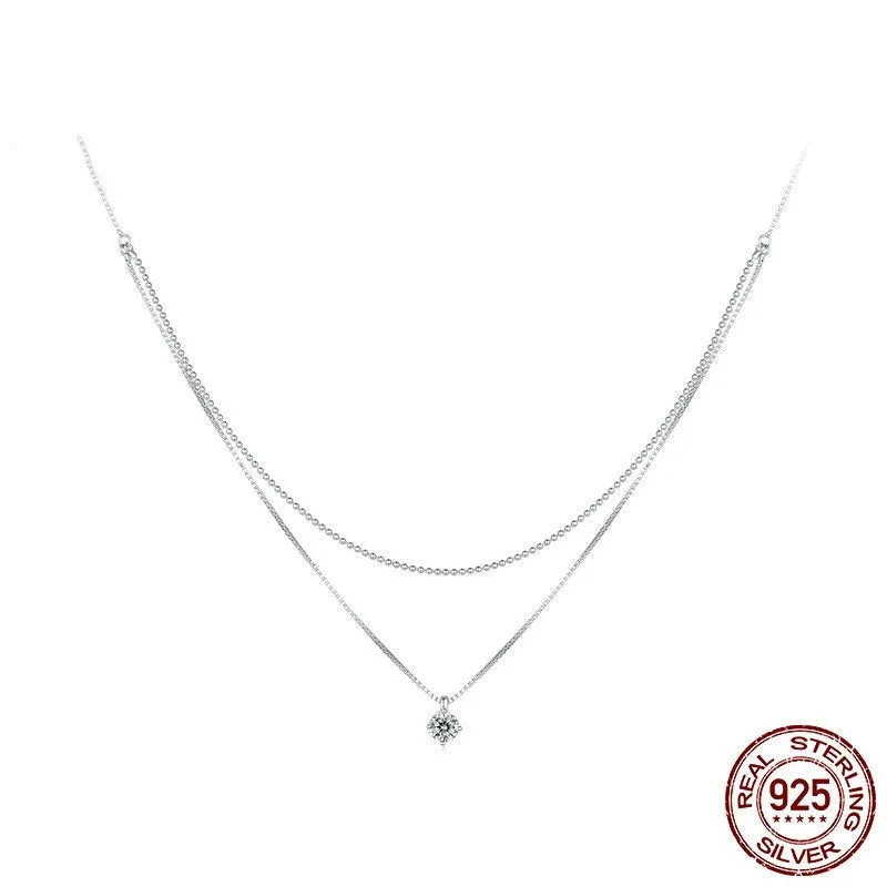 Double-layer sterling silver necklace with pearl chain and silver pendant