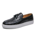 Men's black business casual sneakers with tassel detail on artificial PU leather upper