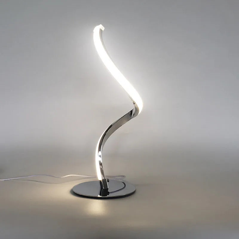 Advanced touch dimming desk lamp in white with white light mode on a bedside table