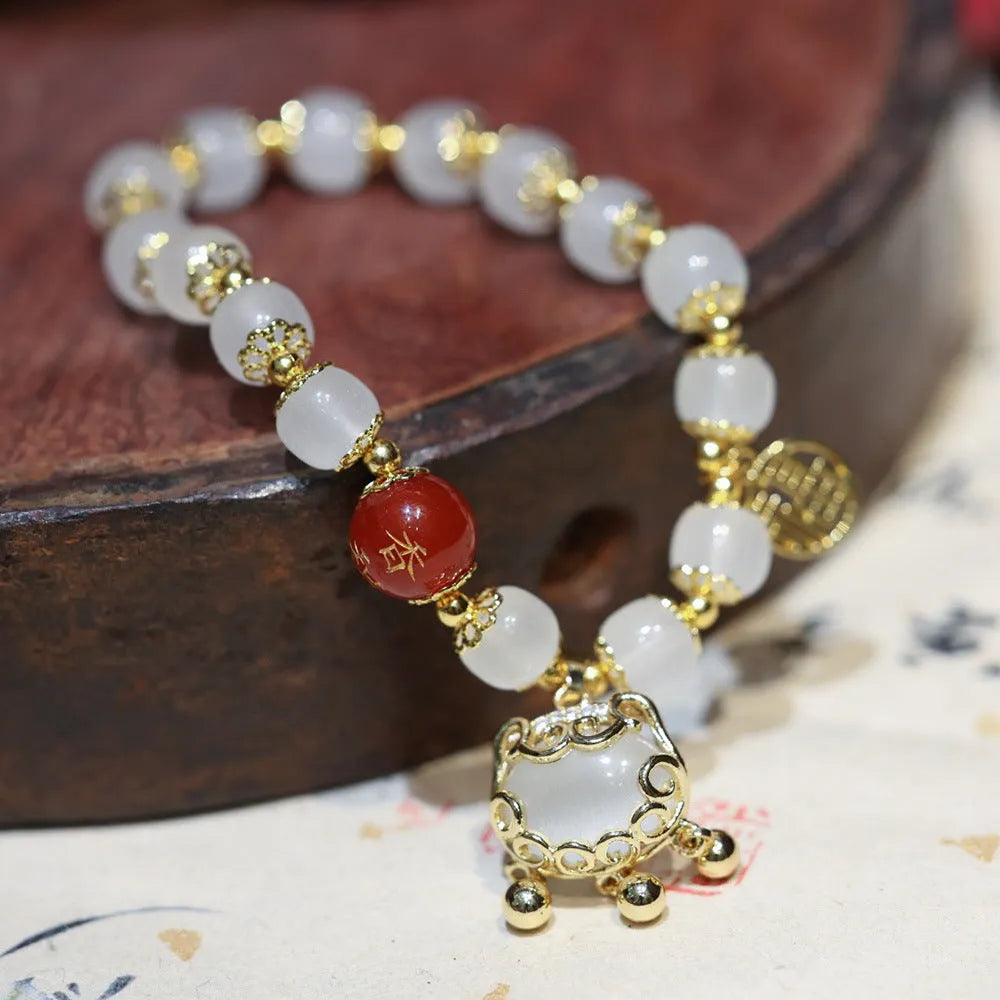 Women's Chinese style coloured glaze glass bracelet with safety lock, windmill, and bamboo charms