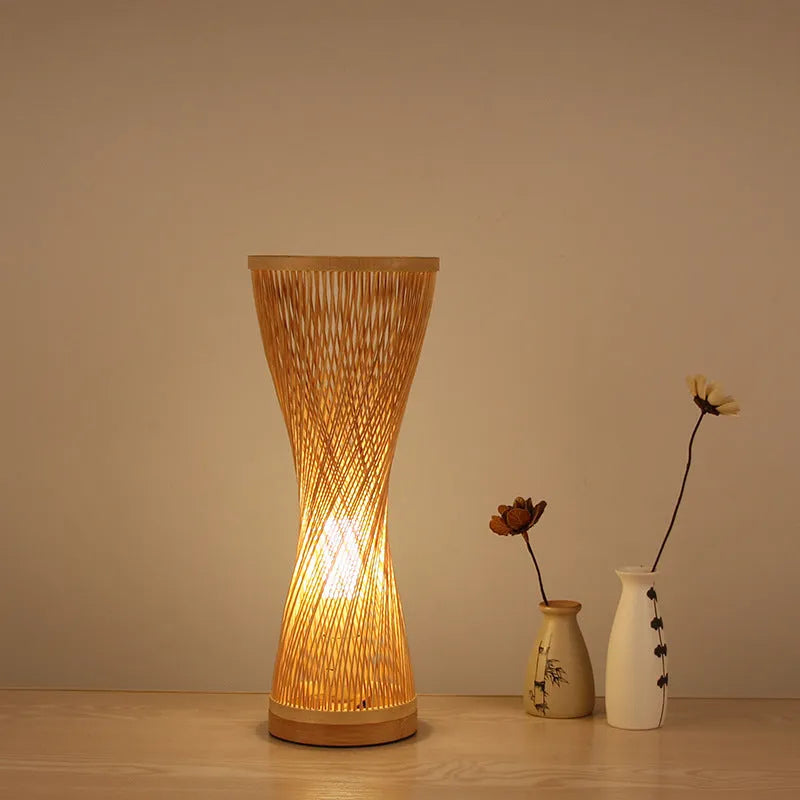 Hand-woven bamboo bedside lamp with natural finish, 40cm height, on wooden bedside table