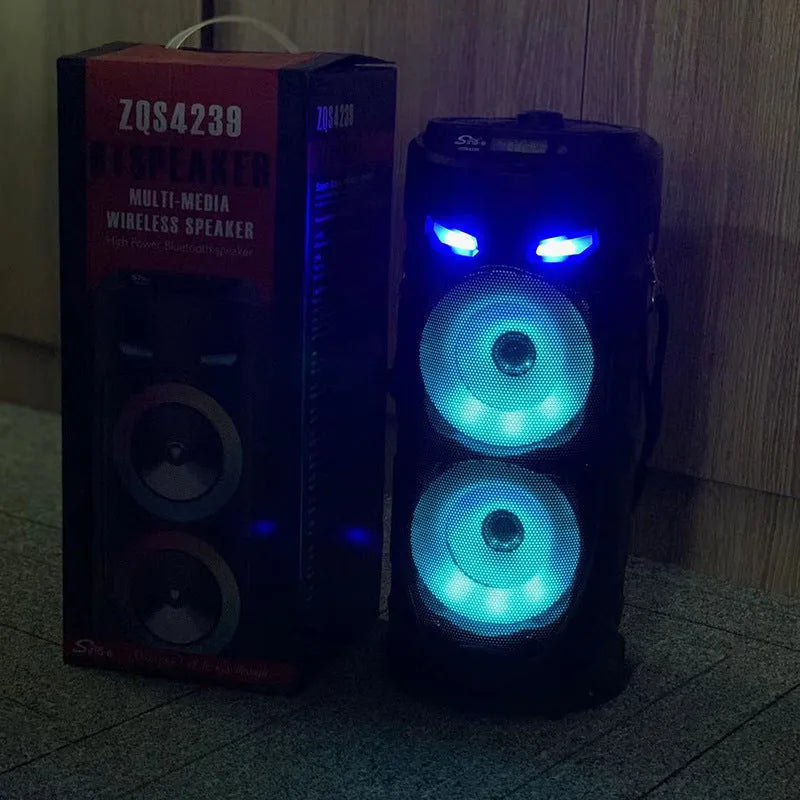 Black portable Bluetooth speaker with dual horn cannon design showing front panel with controls