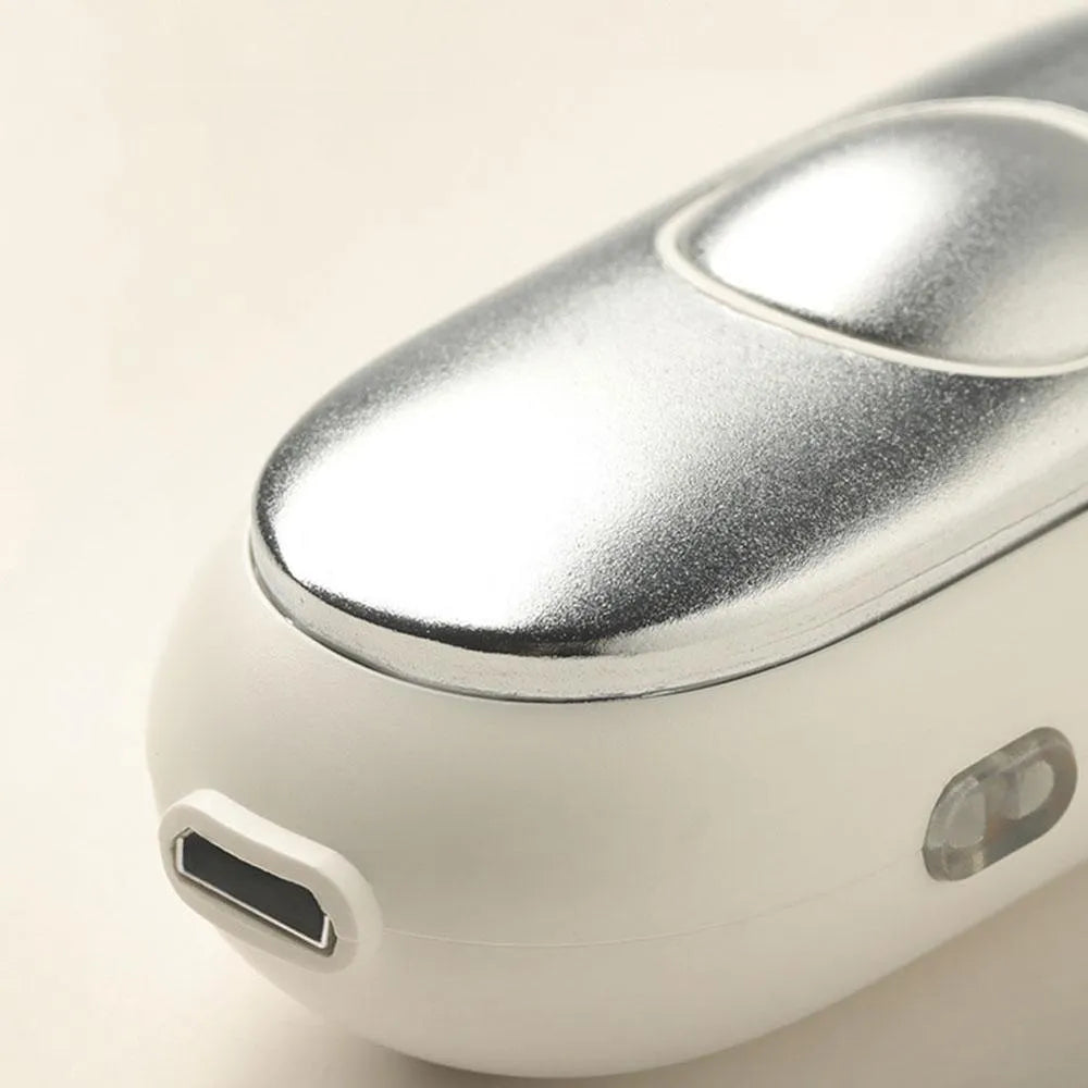 Handheld micro-current sleep aid device in grey, green, or orange colour with USB charging cable.
