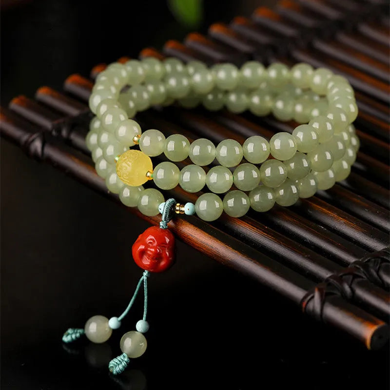 Pale blue Hetian Jade bracelet with 6mm beads arranged in three-circle pattern on elastic string