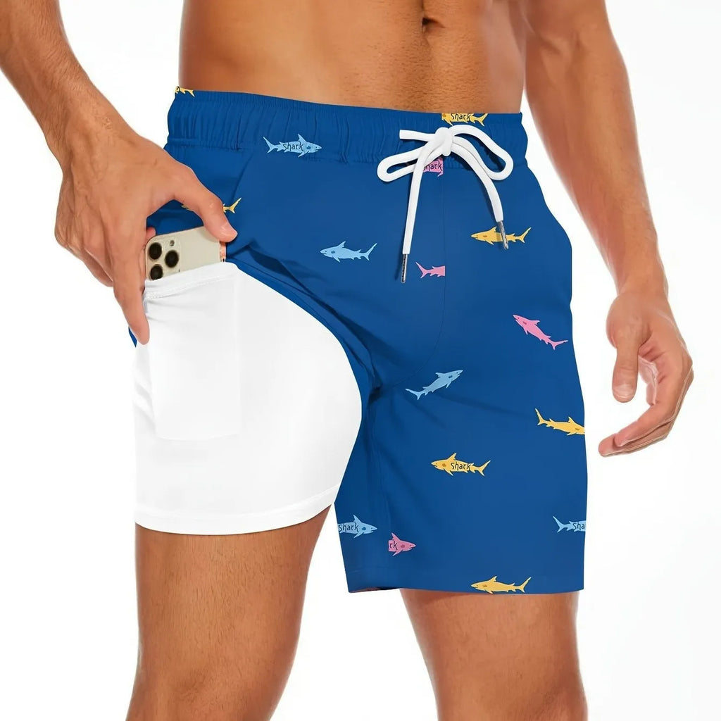 Men's black shorts with a white shark graphic print and a white drawstring waist.