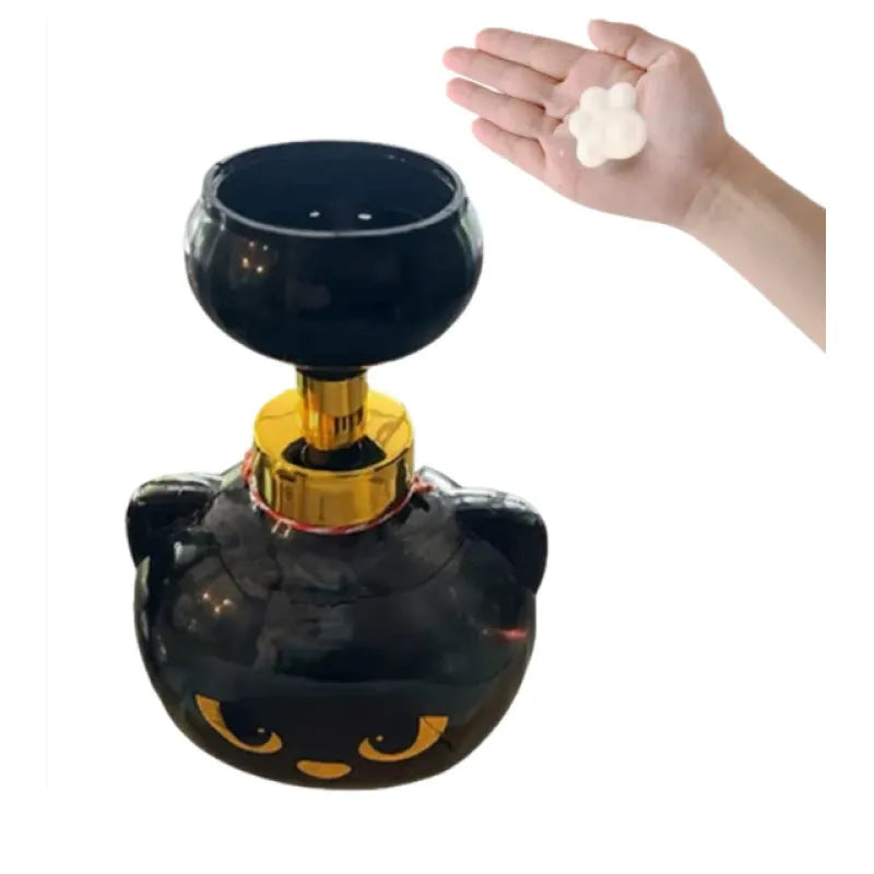 Black plastic cartoon cat shaped foam soap dispenser on a bathroom counter.