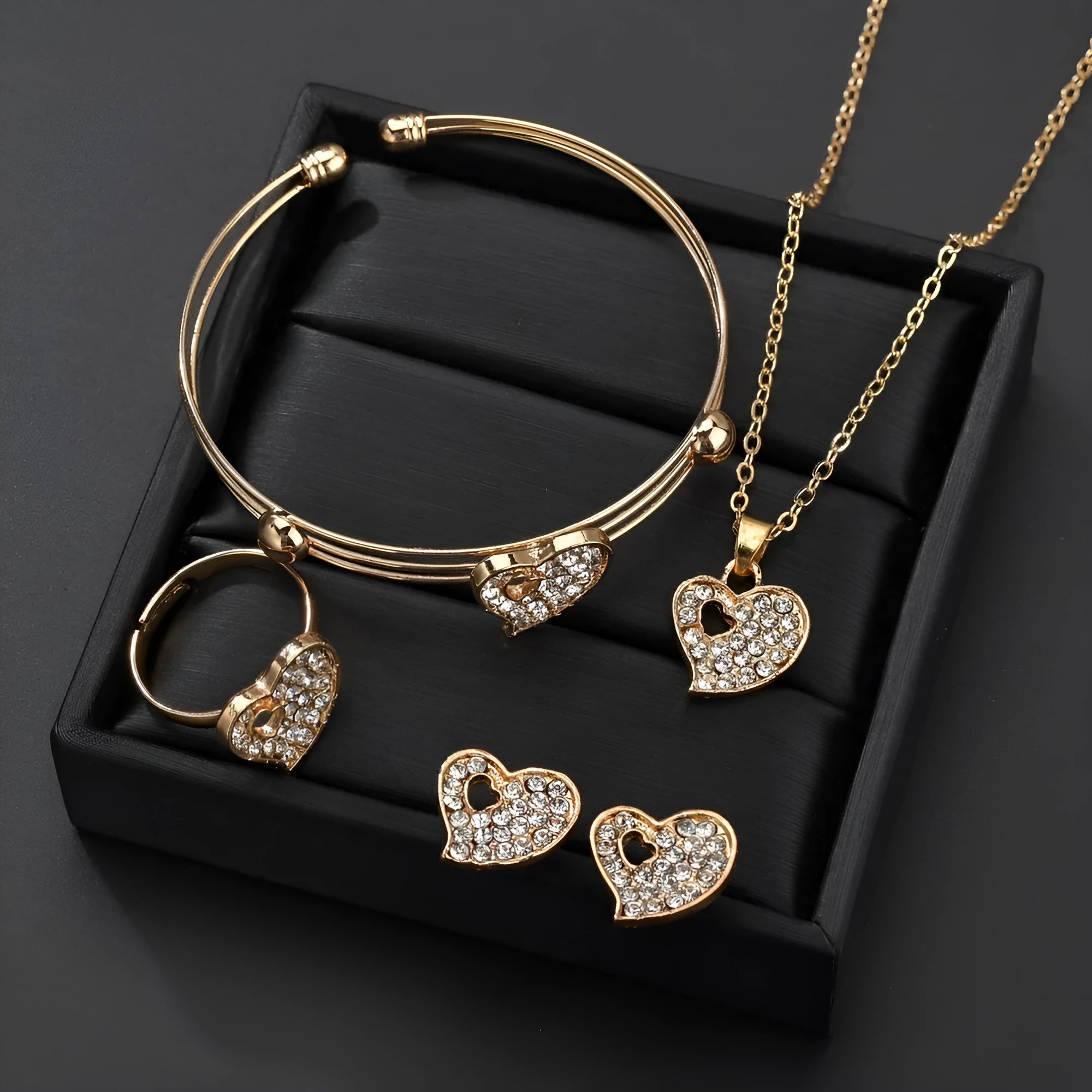 Women's gold electroplated alloy jewellery set with earrings, necklace and bracelet featuring Love, Water Drop and Bell patterns