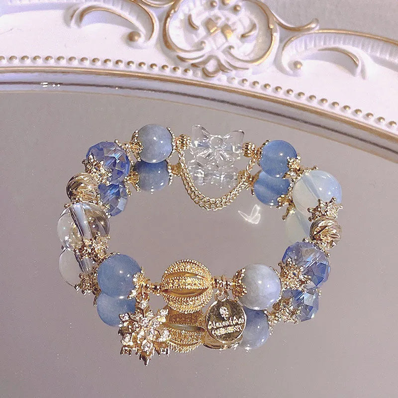 Women's Galaxy colour bracelet with snowflake pendant, bow charm, and cartoon character design