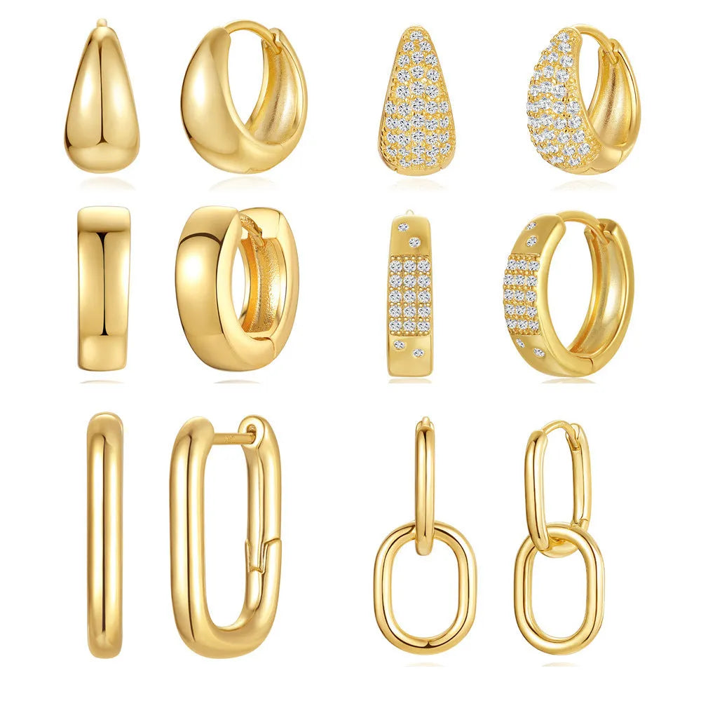 A pair of round geometric brass clip earrings with a gold electroplated finish on a white background.