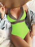 Women's deep V-neck one-piece swimsuit with spaghetti straps in a printed pattern