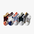 Children's low-cut boat socks in combed cotton with non-slip sole, shown in white, pink, bright, and dark colours, sizes XS to XL
