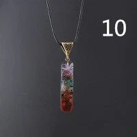 Chakra-inspired acrylic pendant with a unique geometric design and natural variations in the stone patterns