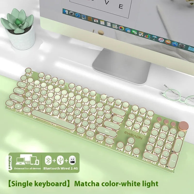 Matcha green 87-key mechanical gaming keyboard with aluminium frame and white backlighting on a desk.