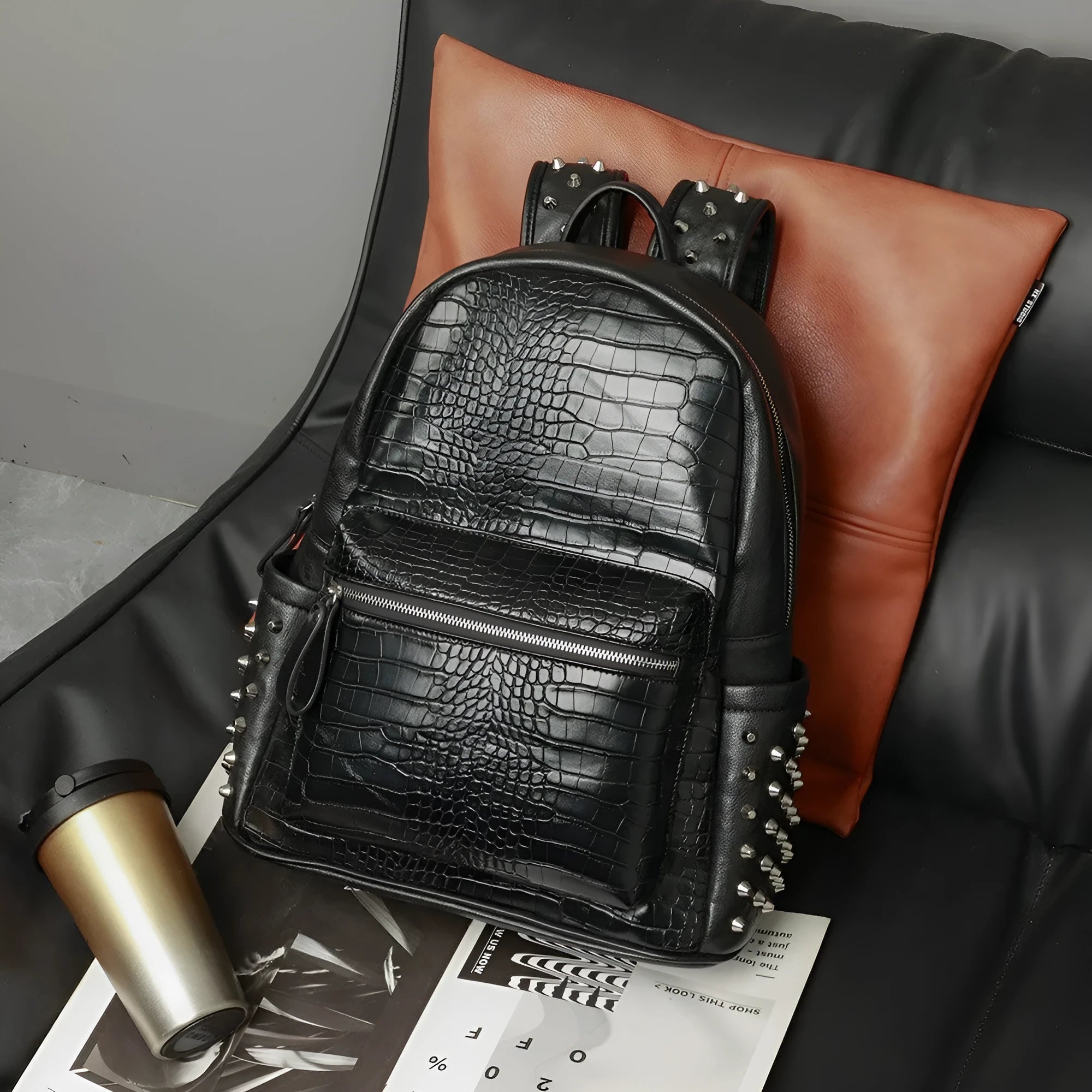 Black PU leather computer schoolbag with rivets showing 55 litre capacity