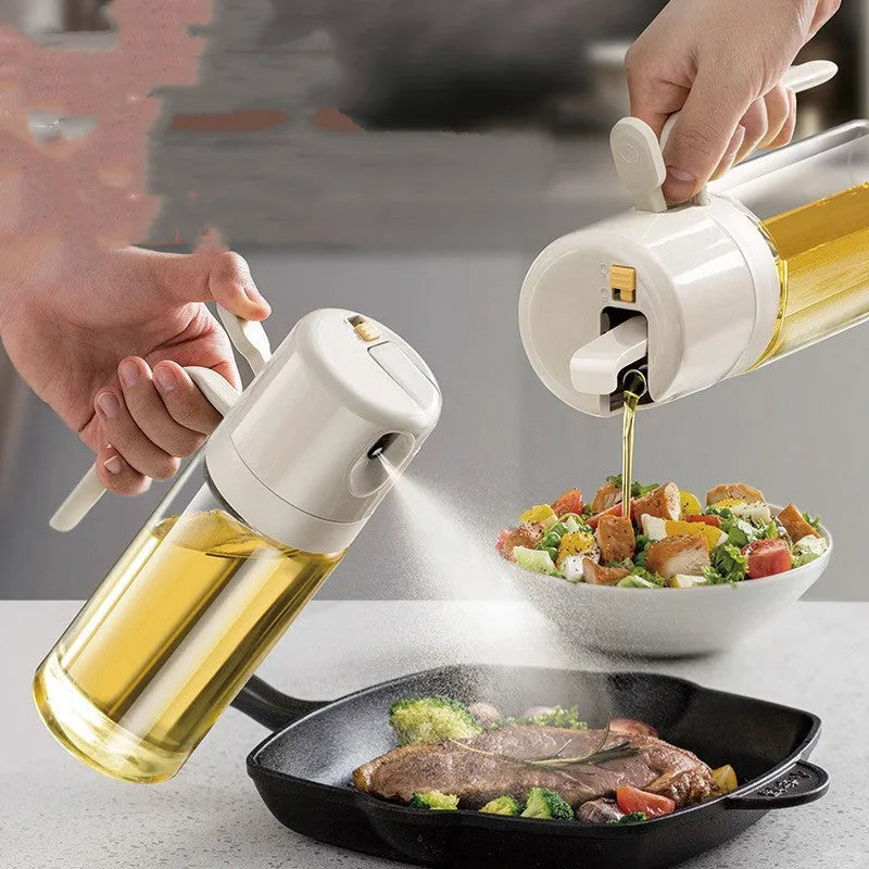 Warm grey glass oil spray bottle with a black lid and switch for selecting spray or pour mode.