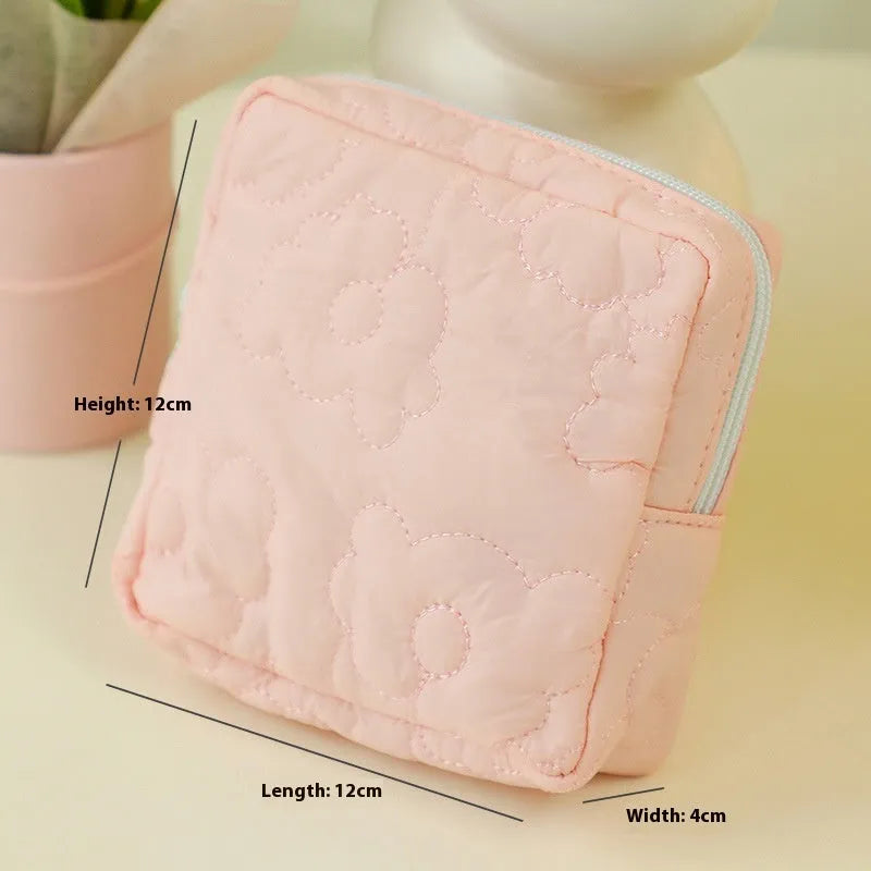 Women's silk quilted storage bag in pink candy colour showing quilted texture and medium size