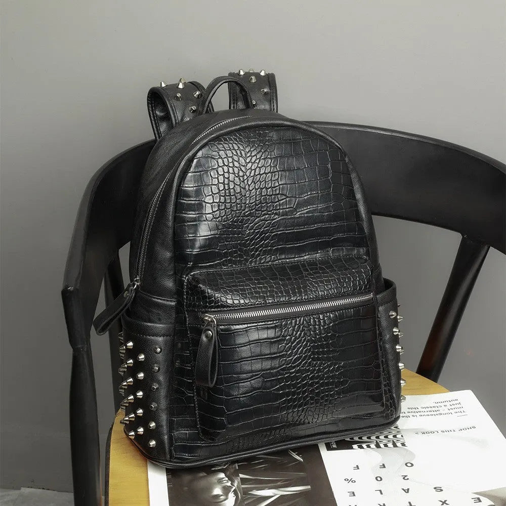 Black PU leather computer schoolbag with rivets showing 55 litre capacity
