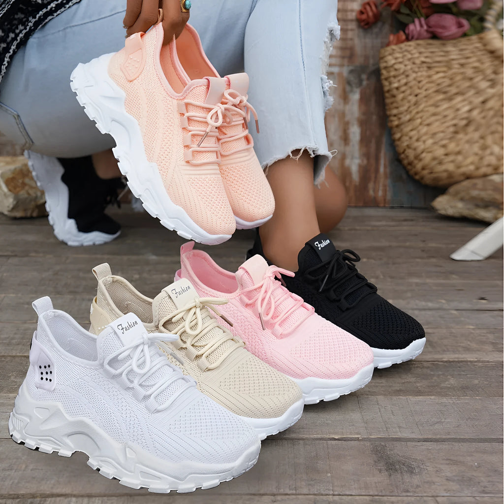 Women's Flyknit mesh casual sports shoes in multiple colours, showing lace-up design and flat sole.