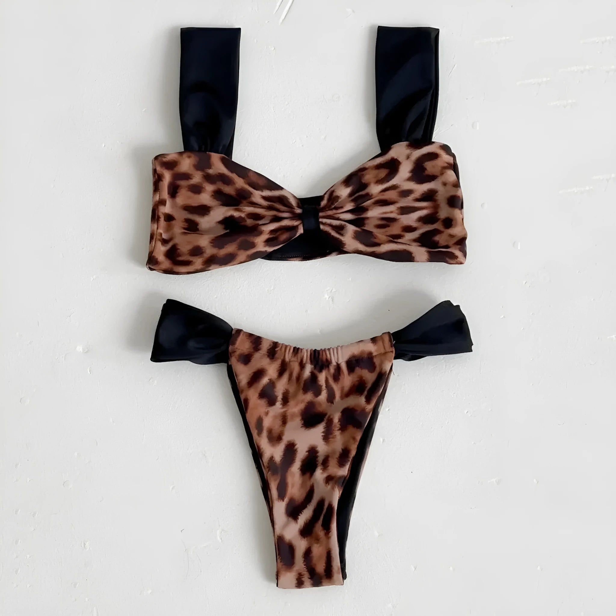 Women's leopard print tube top bikini set with matching T-pants on a mannequin.