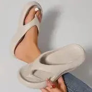 Women's thick-soled flip flops with non-slip textured soles in black, white, and grey colour options