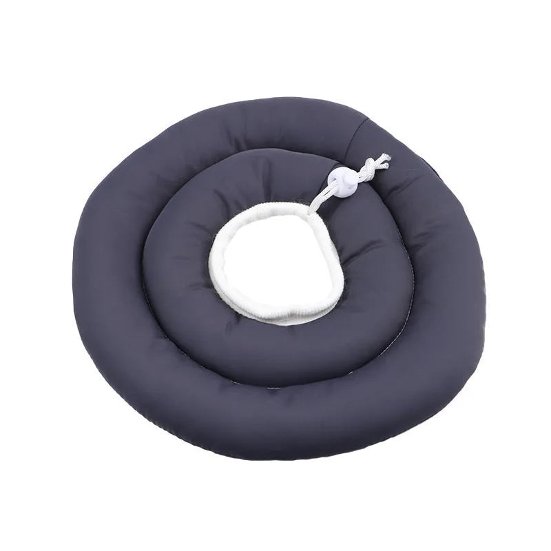 Blue adjustable Elizabethan recovery collar for a dog or cat on a white background