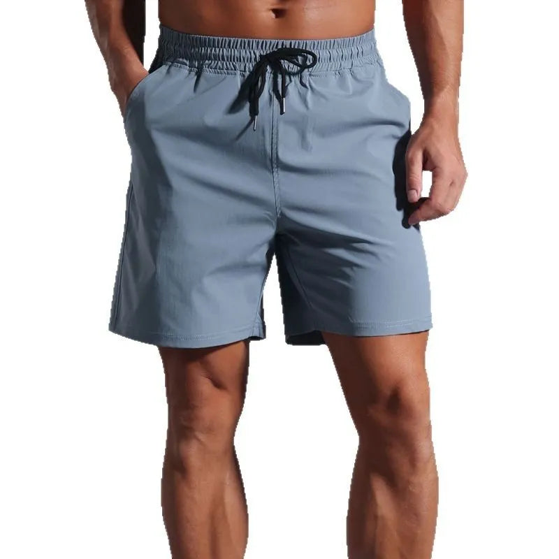 Men's loose fit casual shorts in quick-drying polyester fabric available in four colours