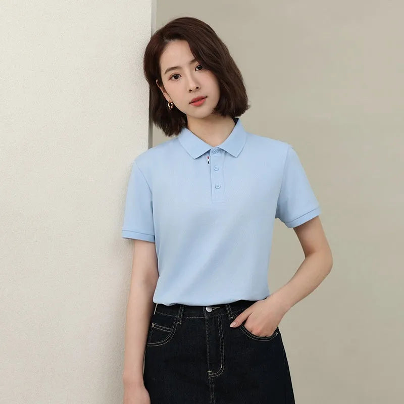 Solid colour short sleeve catering work polo shirt on a hanger, available in multiple colours.