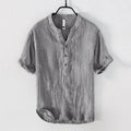 Women's grey linen short sleeve pullover top on a hanger