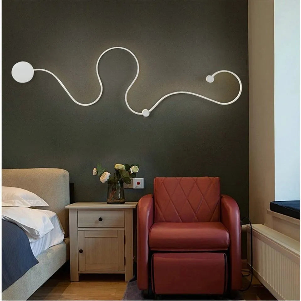 Black and white aluminium shade LED wall lamp in small, medium, large, and plus sizes
