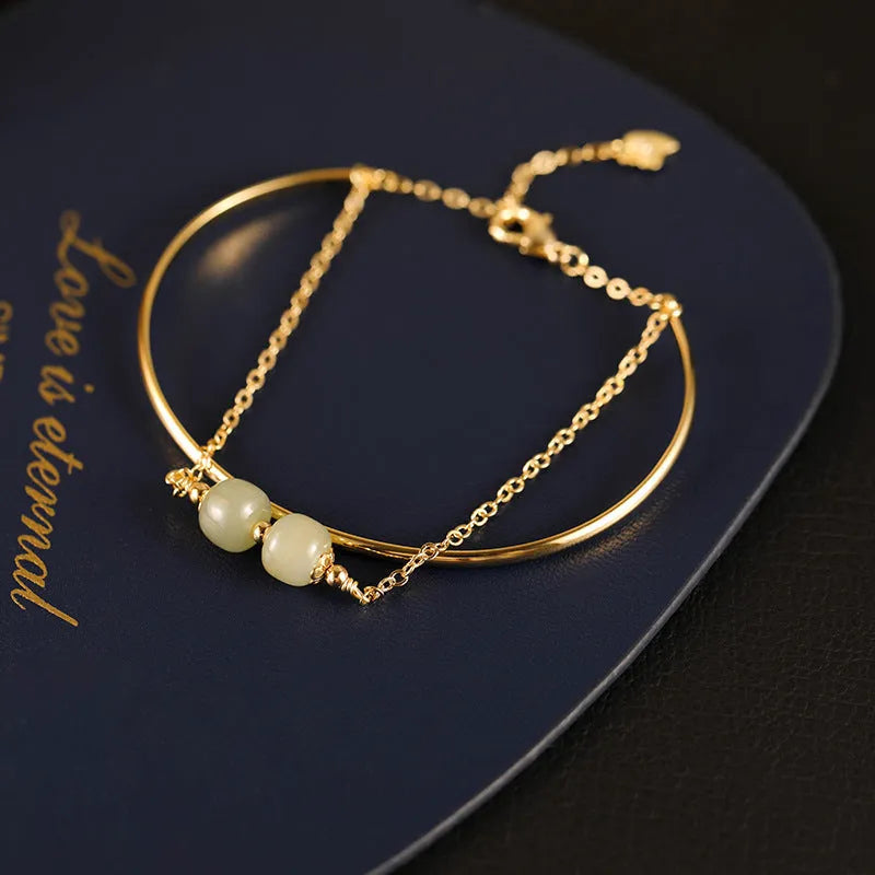 Women's Hetian jade lucky beads bracelet with gold inlay, shown in single, double, and three bead version styles.