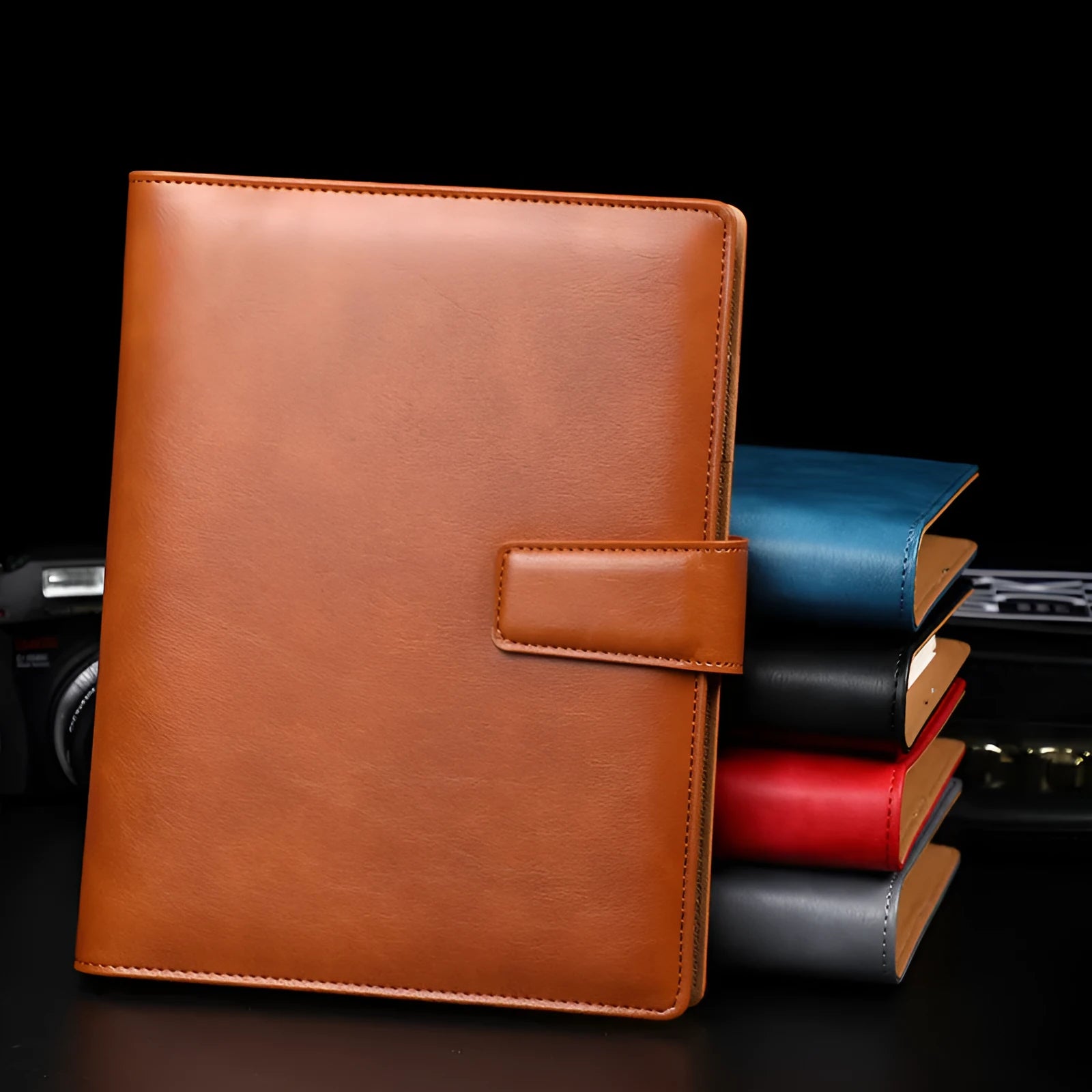 A5 leather notebook with 6-hole binder clip closure and hard cover