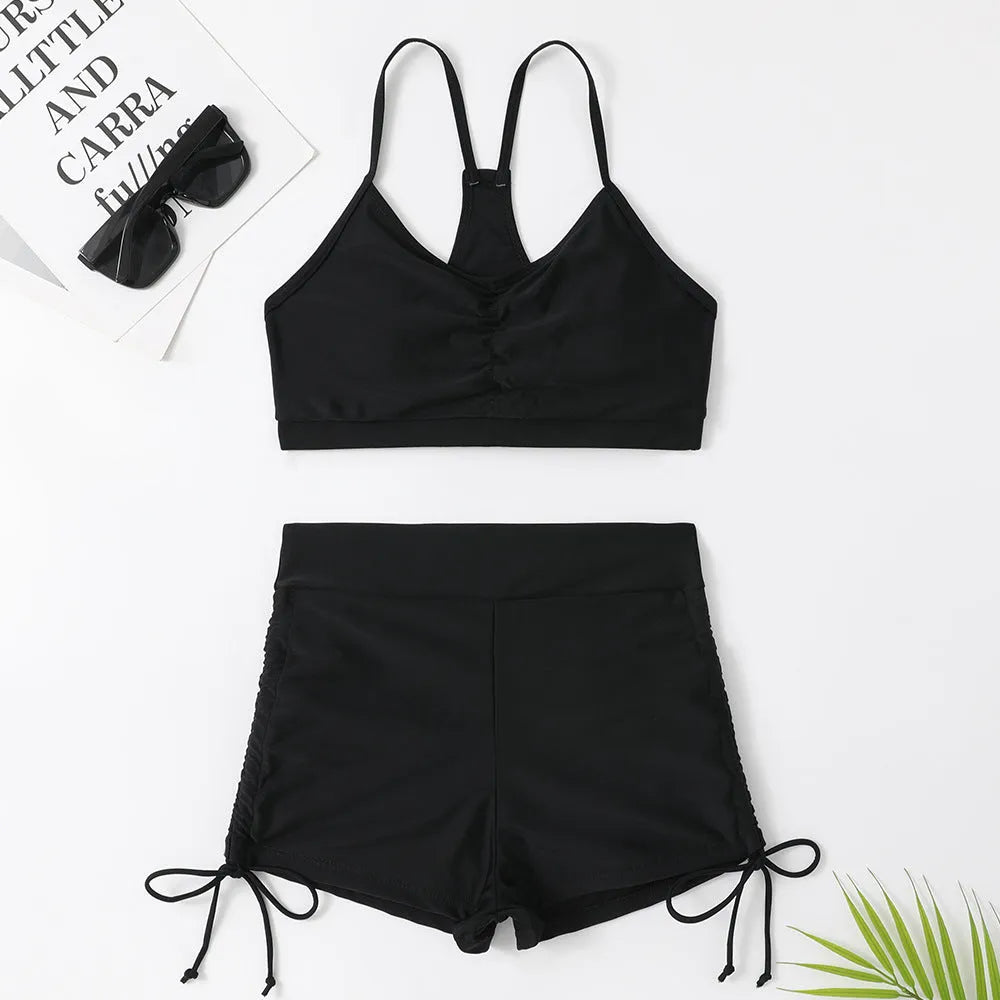 Purple women's high-waist split bikini swimsuit top and shorts set.