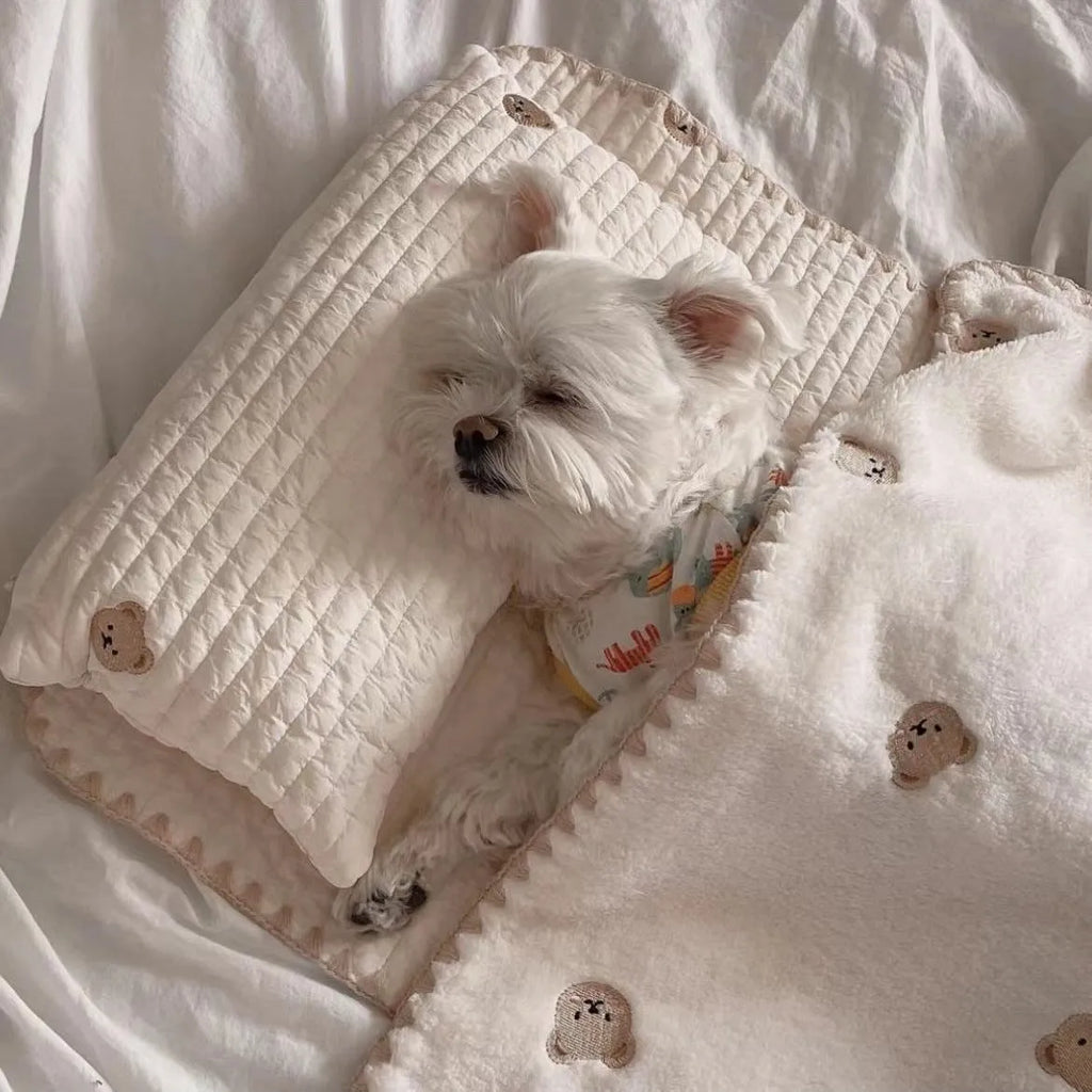 Bear-patterned dog bed set with pillow, mattress, and quilt components in removable washable design