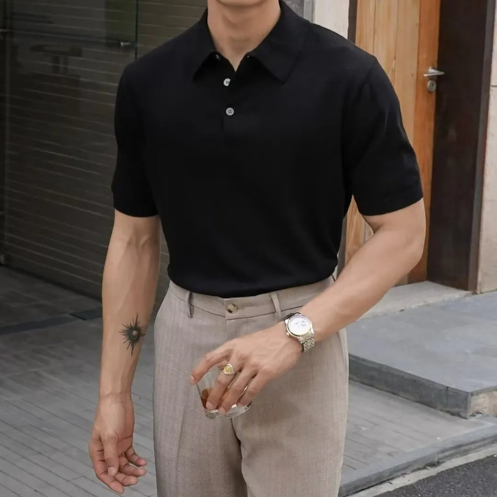 Knitted short-sleeve polo shirt in ice silk cotton fabric on a hanger, showing polo collar detail.