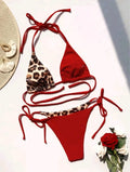 Women's leopard print halter bikini with lace-up front and split-bottom design