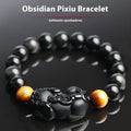 Black Mexican Gold Sheen Obsidian Pi Xiu charm bracelet with crystal beads.