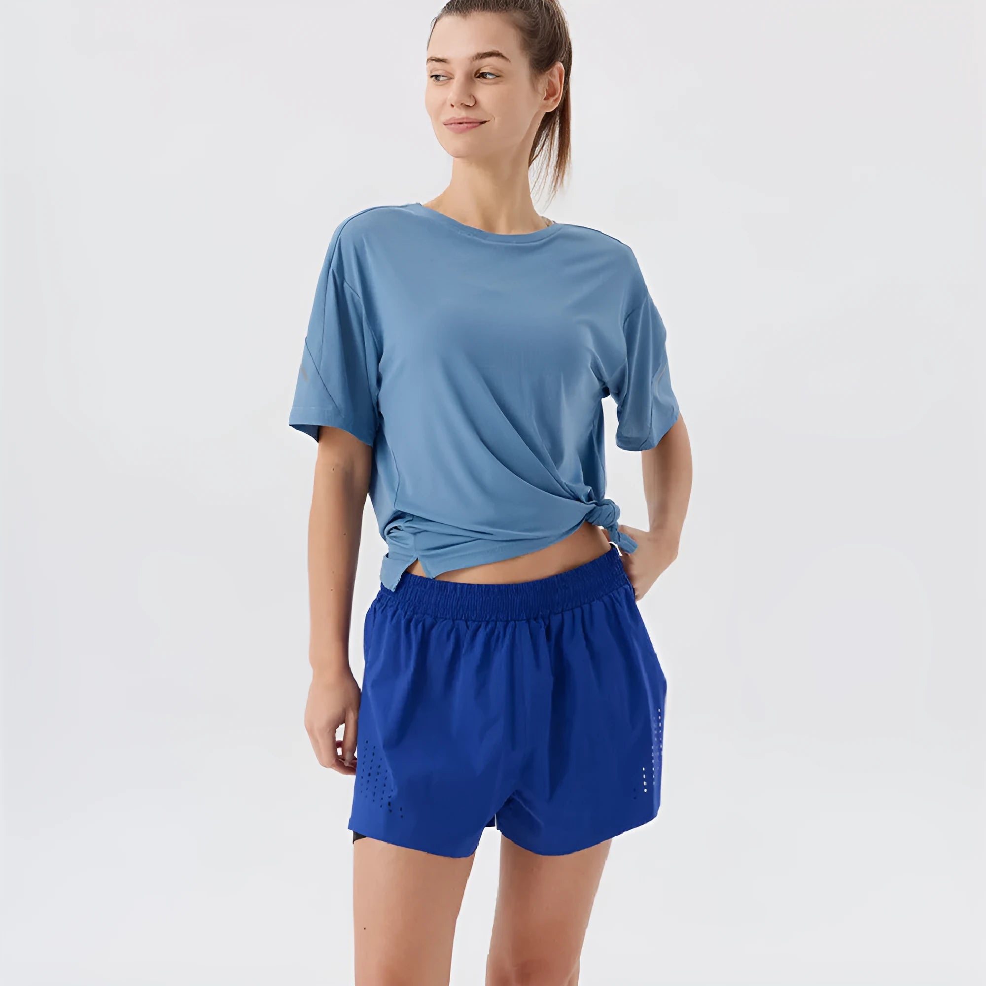 Men's straight-leg nylon sports shorts in black with side slits on leg.