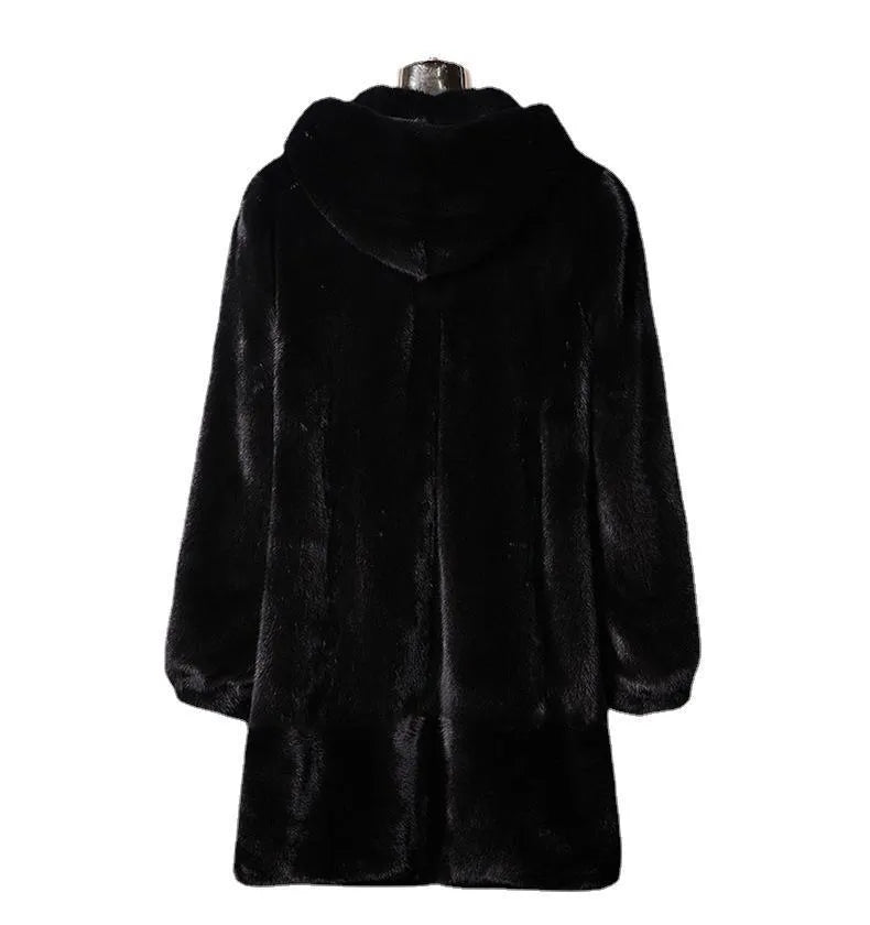 A woman's long black faux fur coat with a hood, shown in a street fashion style.